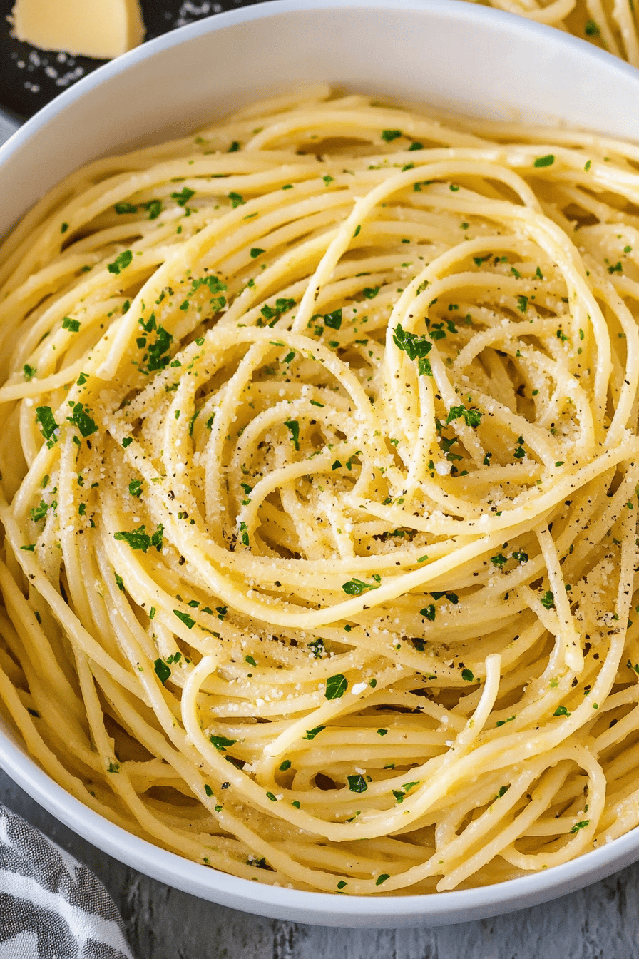 Garlic butter pasta slice on plate showing perfect texture and swirl pattern