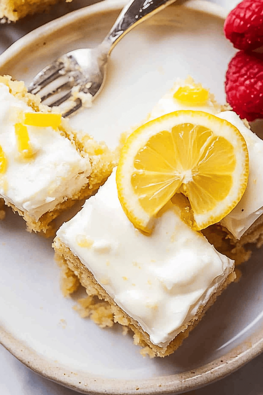 lemon coconut bars slice on plate showing perfect texture and swirl pattern