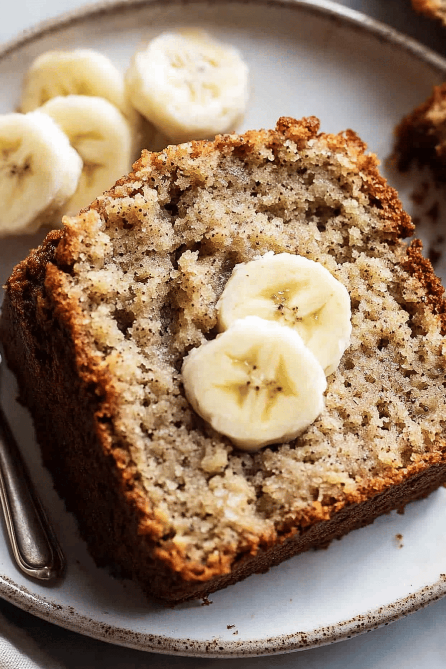 protein banana bread slice on plate showing perfect texture and swirl pattern
